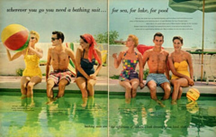 four people sitting on the edge of a swimming pool, one holding a beach ball