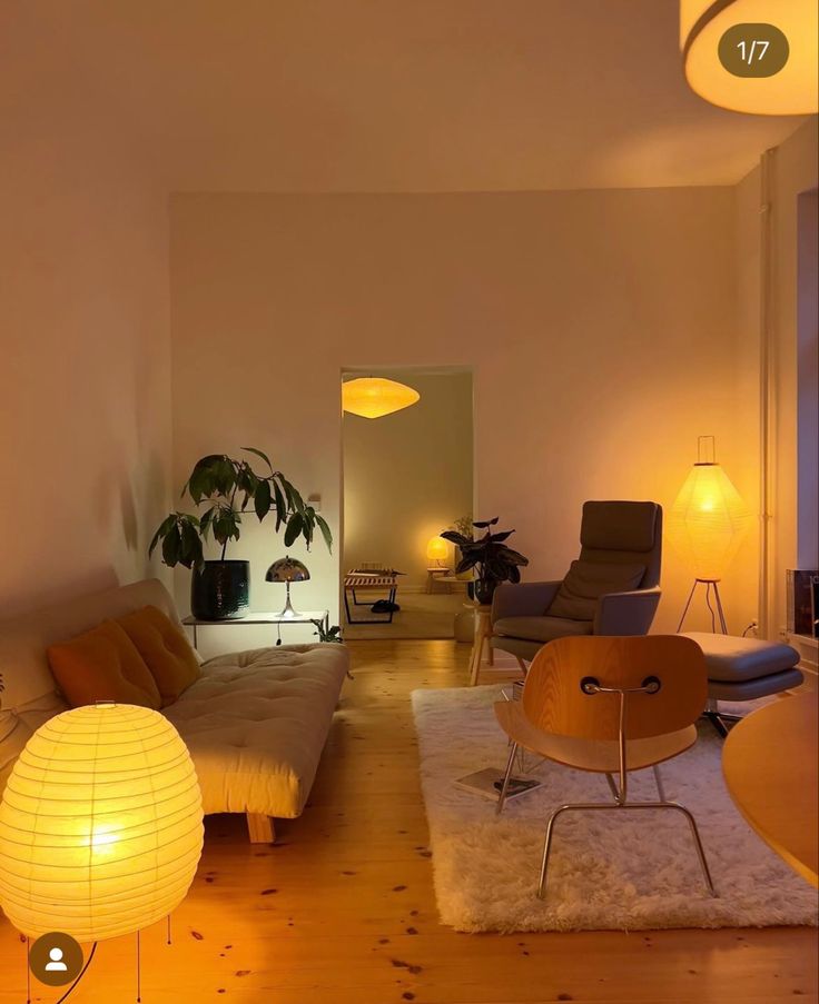 a living room filled with furniture and lights