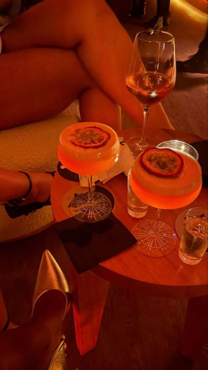 two desserts and wine glasses on a table