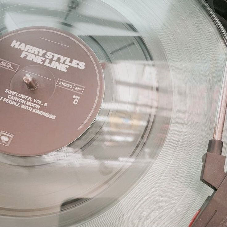 an old record player with the label harry styles fineline on it's side