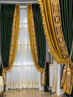 an elegant living room with green and gold curtains