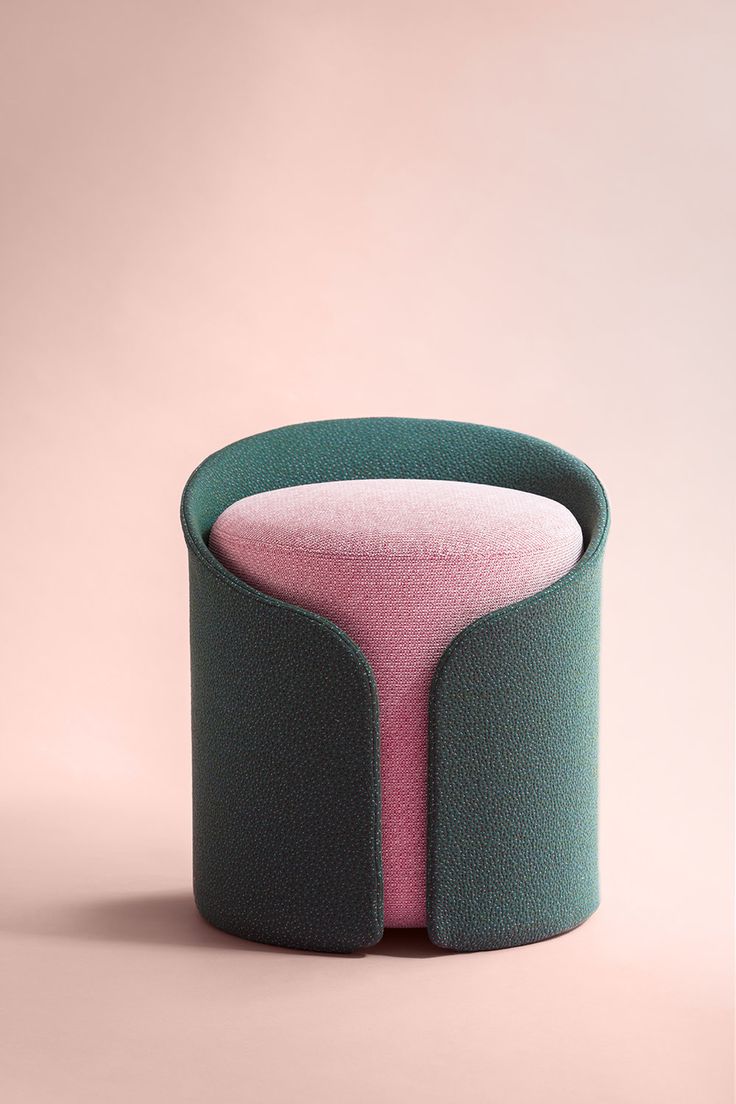 a pink and green object sitting on top of a table