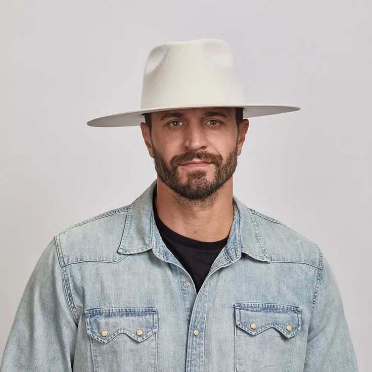 Man with a beard wearing a White Rancher Hat and a denim jacket over a black shirt. Classic White Hat With Flat Crown, Classic White Flat Crown Hat, White Flat Crown Fedora For Kentucky Derby, Classic White Felt Hat With Short Brim, Modern White Hat With Curved Brim, American Hat Makers, Leather Cowboy Hats, Rancher Hat, Felt Fedora