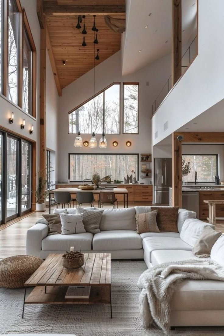 a living room filled with furniture and lots of windows