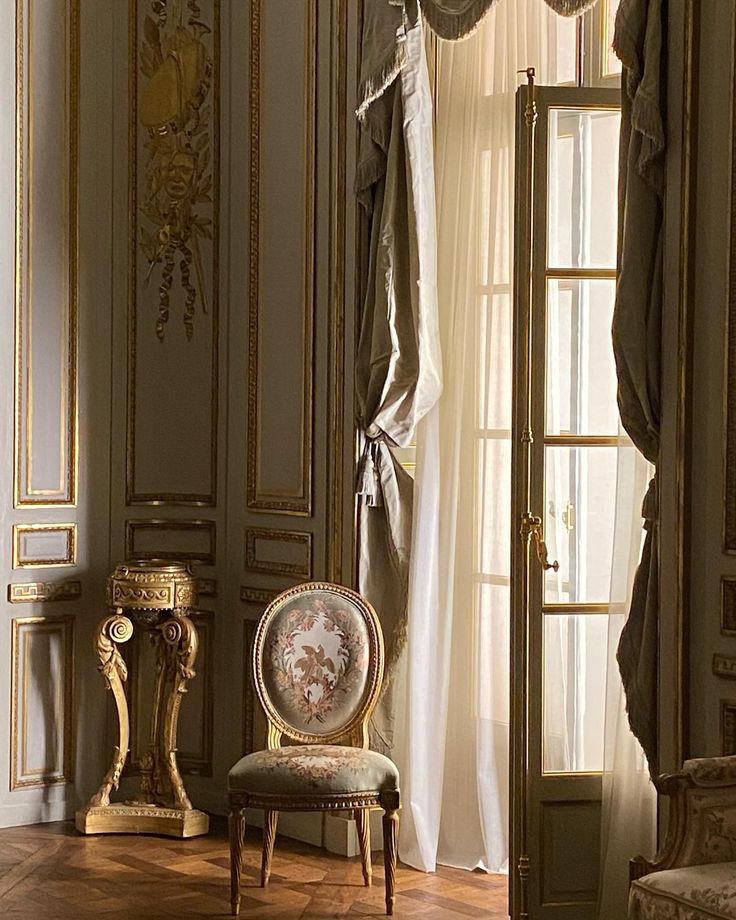 an ornately decorated room with gold trim and curtains