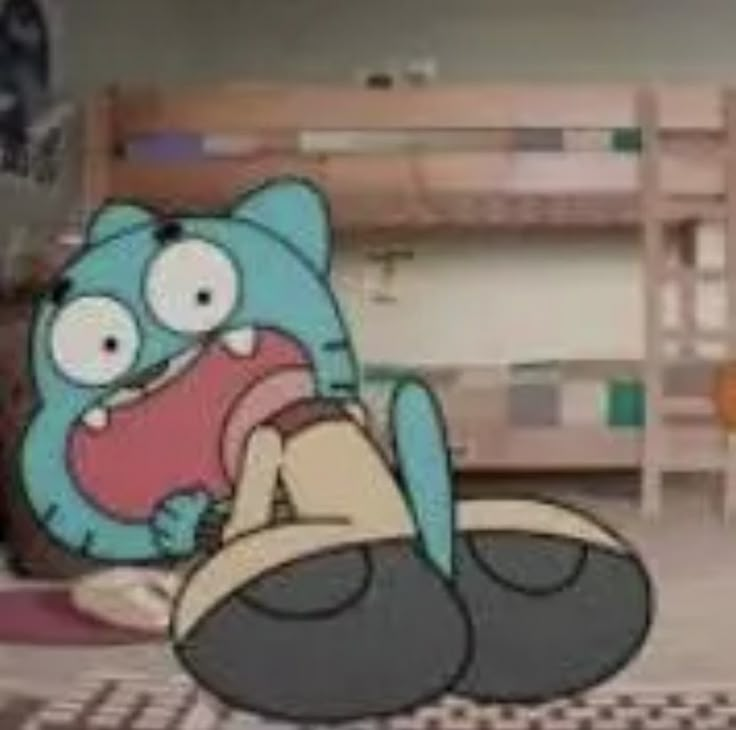 an image of a cartoon character on the floor with his mouth open and tongue out