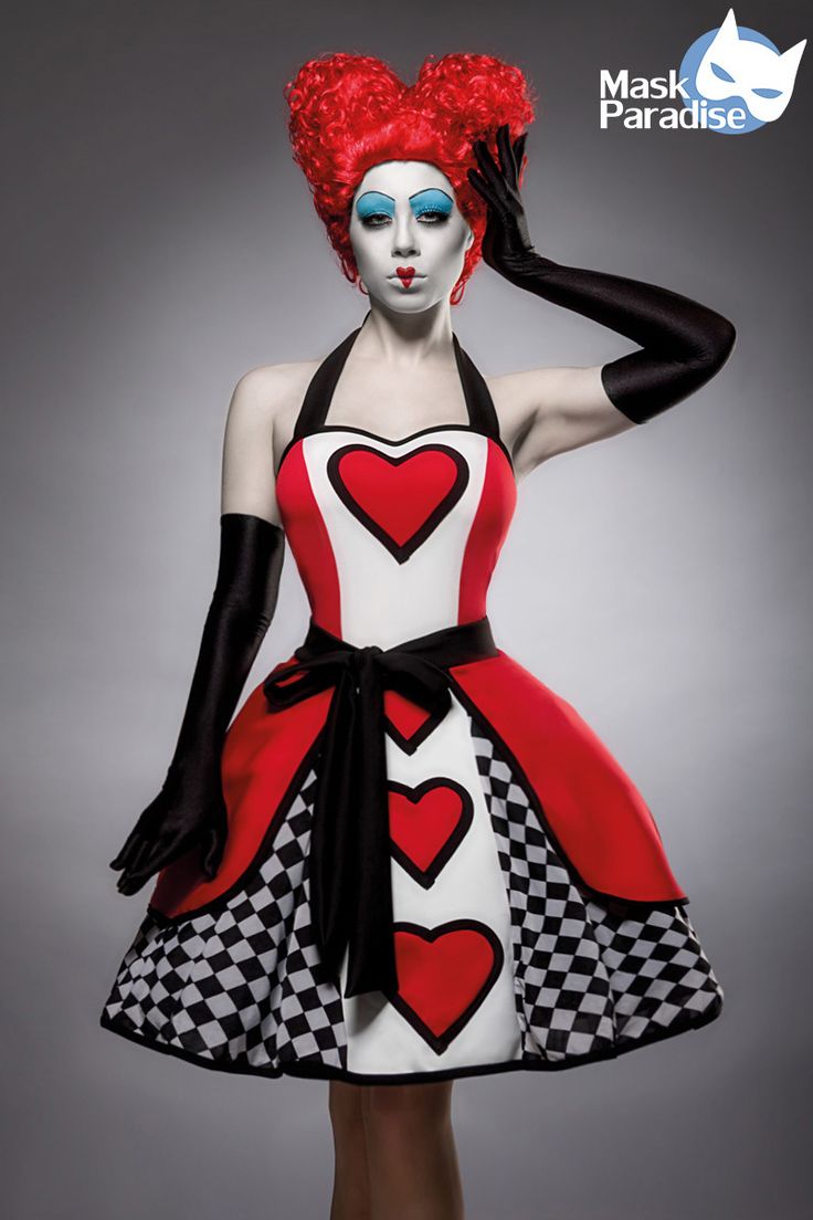 a woman with red hair and makeup wearing a dress made to look like a heart