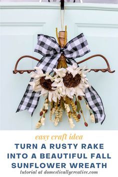 a fall wreath hanging on the front door with text overlay that reads, easy craft idea turn a rusty rake into a beautiful fall sunflower wreath