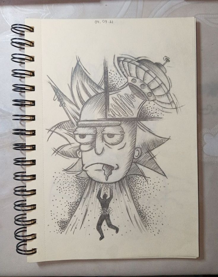 a notebook with a drawing of a sun and a man on it