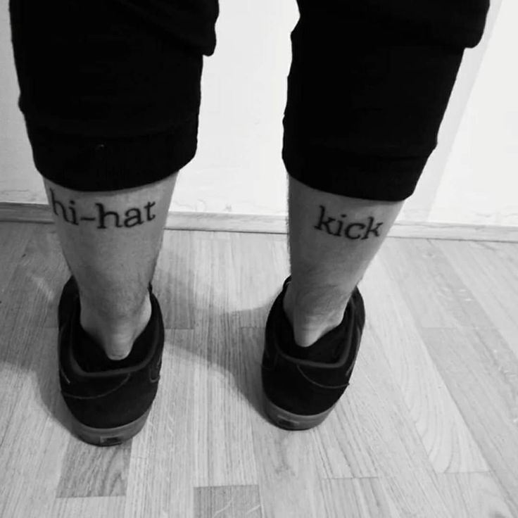 two people with tattoos on their legs standing in front of a door and the words kick written on them