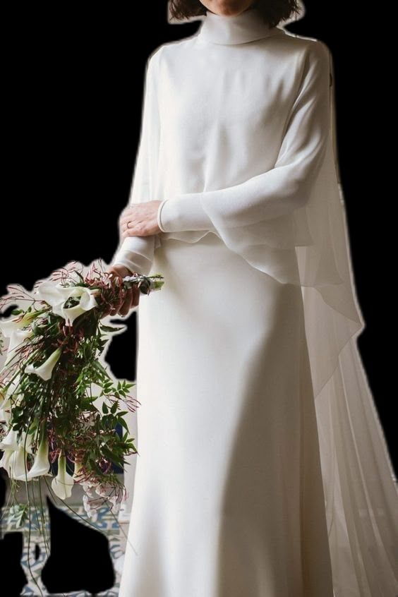 a woman wearing a white dress and holding a flower bouquet in her right hand while standing against a white background