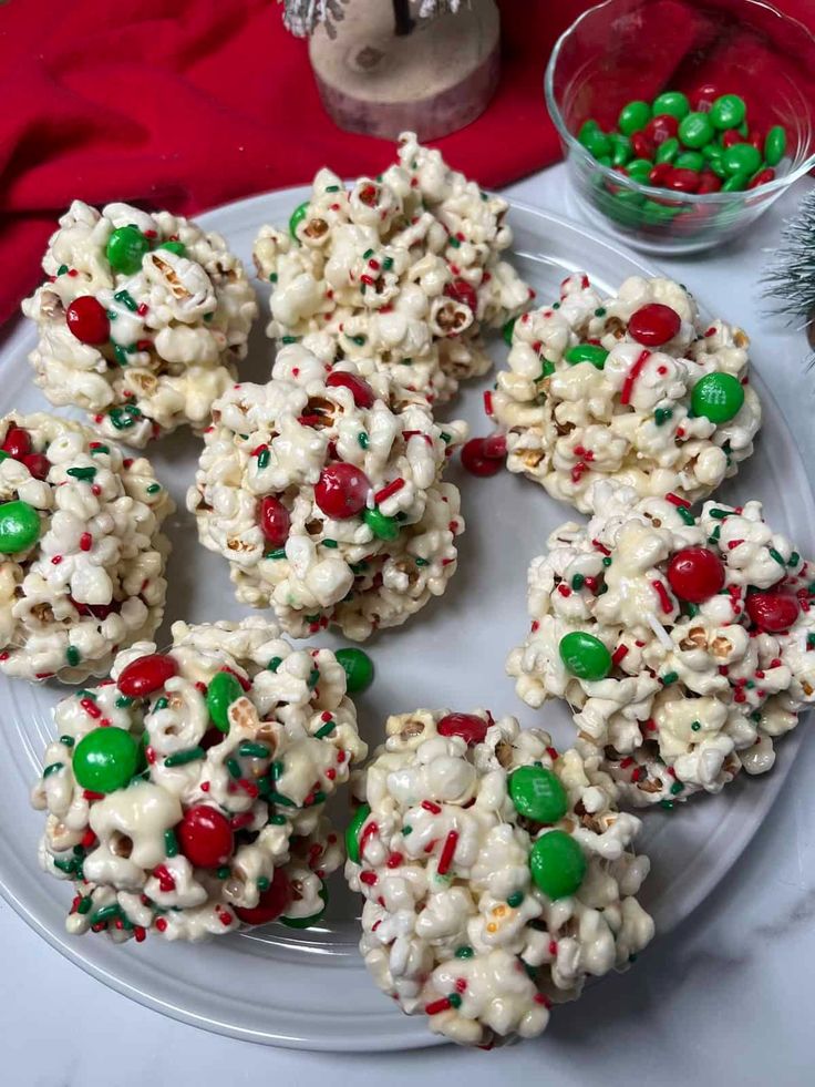 christmas popcorn balls on a plate with candy