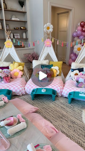 a room filled with lots of pink and blue decorations on top of it's floor