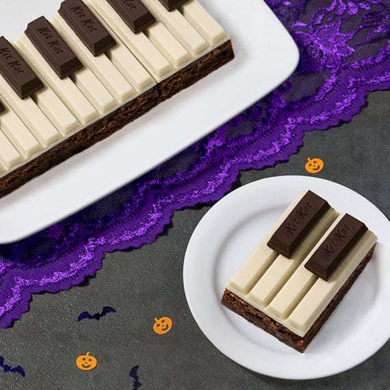 two pieces of cake sitting on top of a white plate next to a purple lace