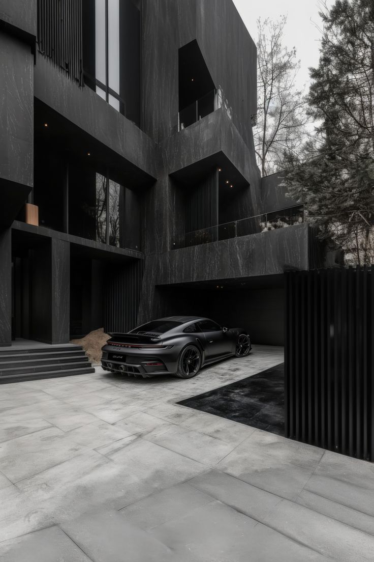 a black sports car parked in front of a building