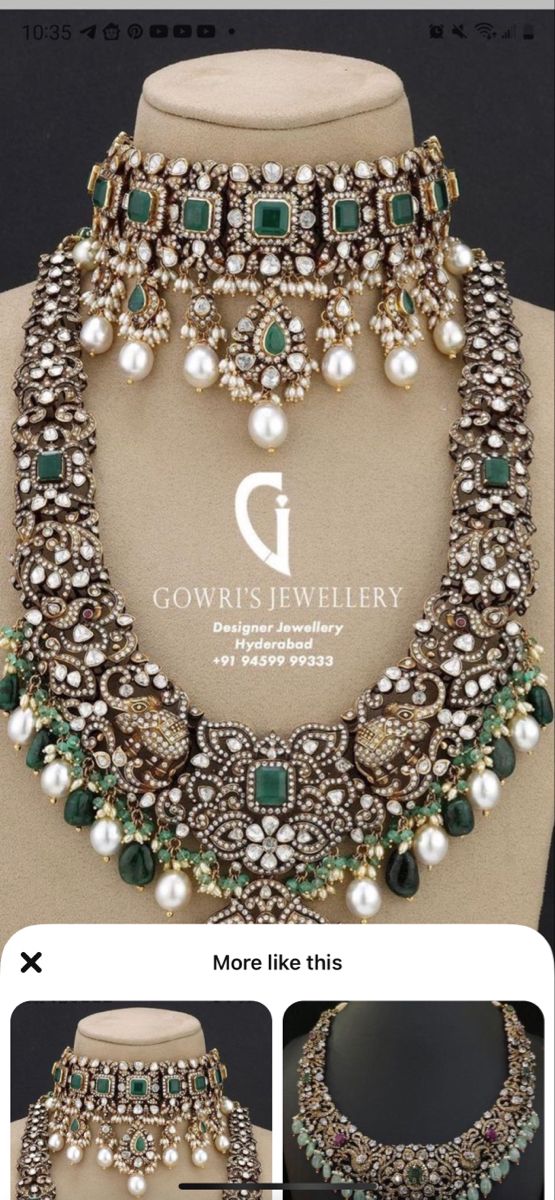 an elaborate necklace with pearls and emeralds