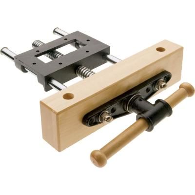 a pair of wooden clamps are attached to the back of a piece of wood