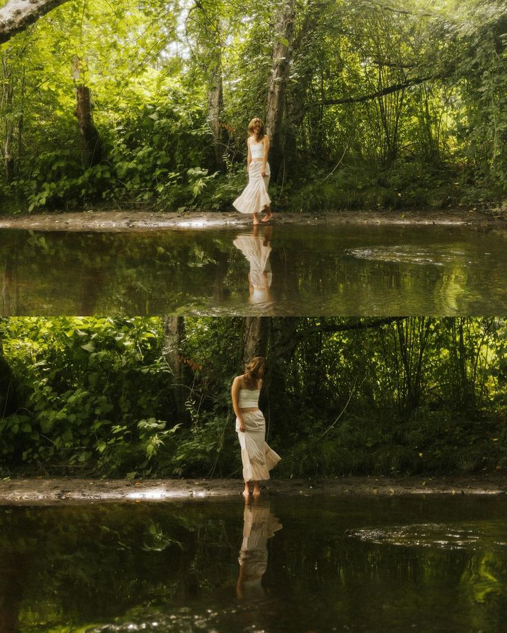 a woman is standing in the water with her reflection on the ground and trees behind her