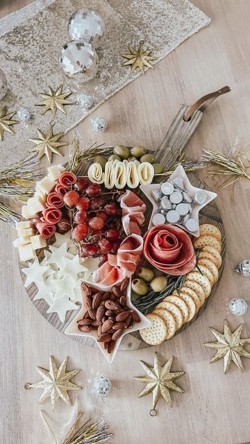 a platter filled with lots of different types of food on top of a wooden table