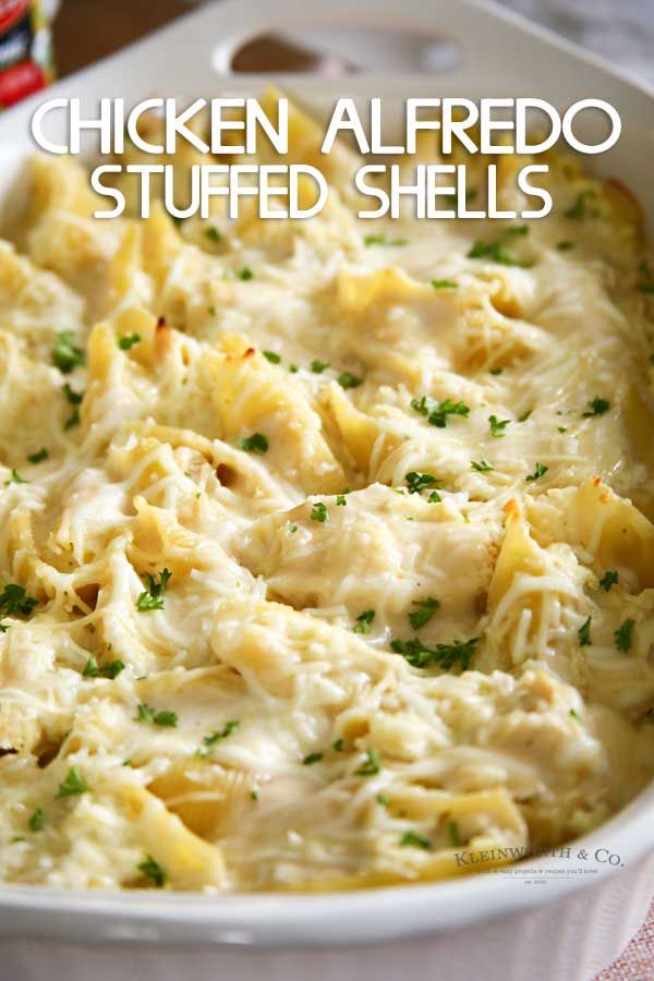 chicken alfredo stuffed shells in a white casserole dish