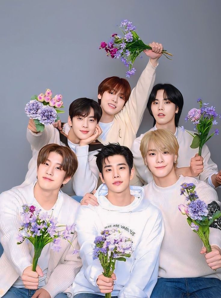 the members of btop are holding flowers