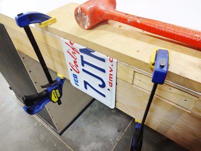 a pair of tools are sitting on top of a workbench