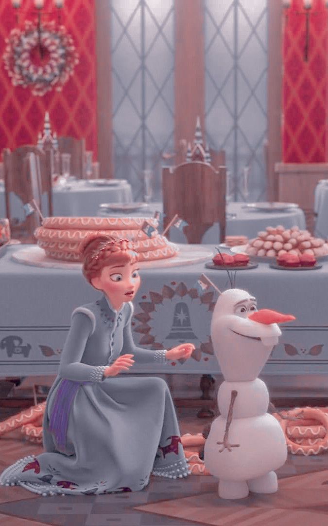 a frozen princess sitting next to a snowman