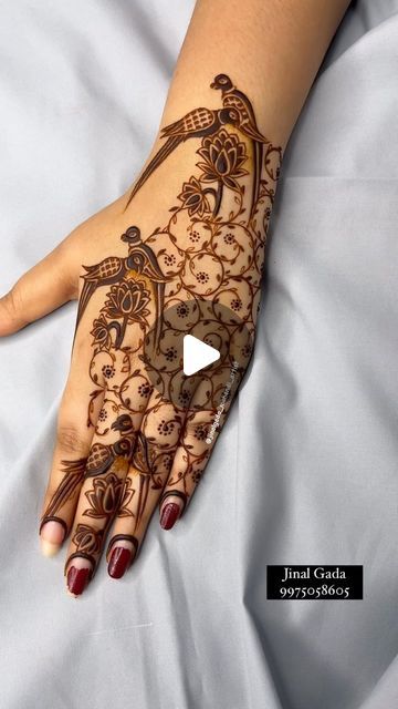 a woman's hand is decorated with hennap and intricate designs on it