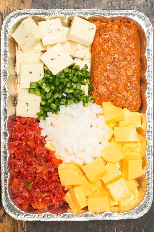 the ingredients for this enchilada casserole are arranged in a pan