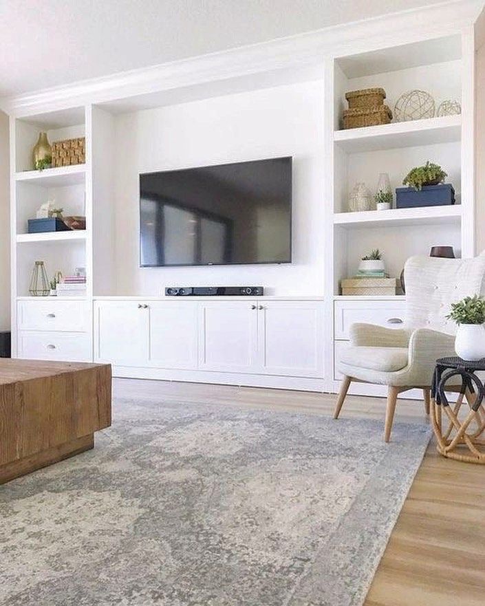 the living room is clean and ready to be used as a home office or entertainment center