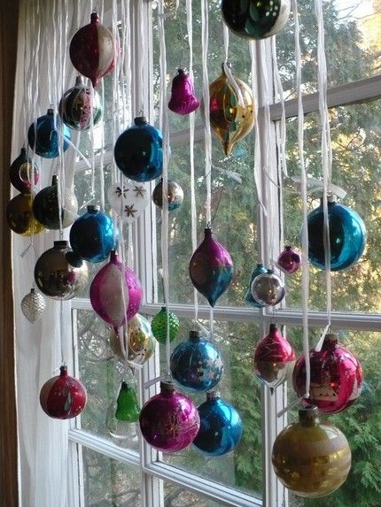 a window with ornaments hanging from it's side