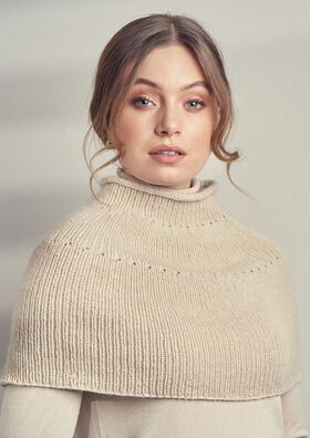 a woman wearing a turtle neck sweater