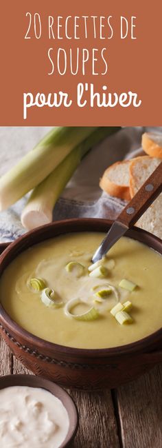 soup in a bowl with bread and celery next to it on a wooden table