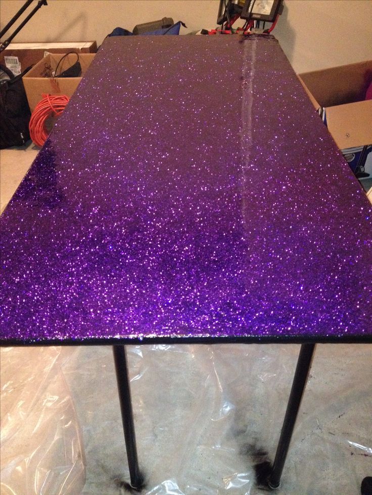 a purple table sitting on top of a plastic bag