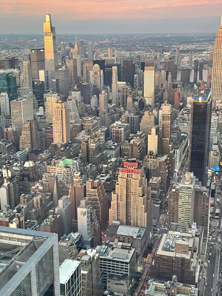 an aerial view of the city with skyscrapers and other tall buildings in the foreground