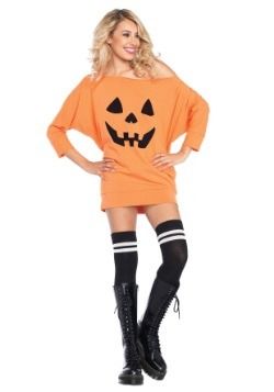 a woman in an orange dress with a pumpkin face on the chest and black knee high boots