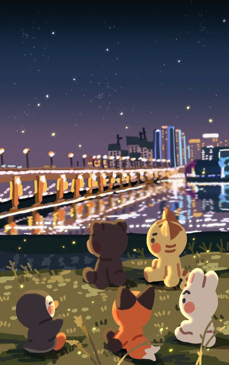 several stuffed animals sitting on the ground in front of a body of water at night