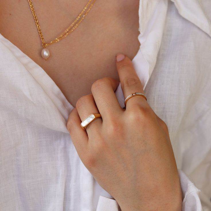 An elegant petite signet ring featuring stunning gems inlay. With a vintage gold color perfectly contrasted by the black agate or white mother of pearl, this statement ring is a must-have. Add a pop of color with this beautiful petite signet ring.• S P E C I F I C A T I O N •Finish: 18K gold Cupid Ring, Iris Ring, Evil Eye Ring, Couple Jewelry, Waterproof Jewelry, Demi Fine Jewelry, Enamel Ring, Matching Rings, Color Dorado