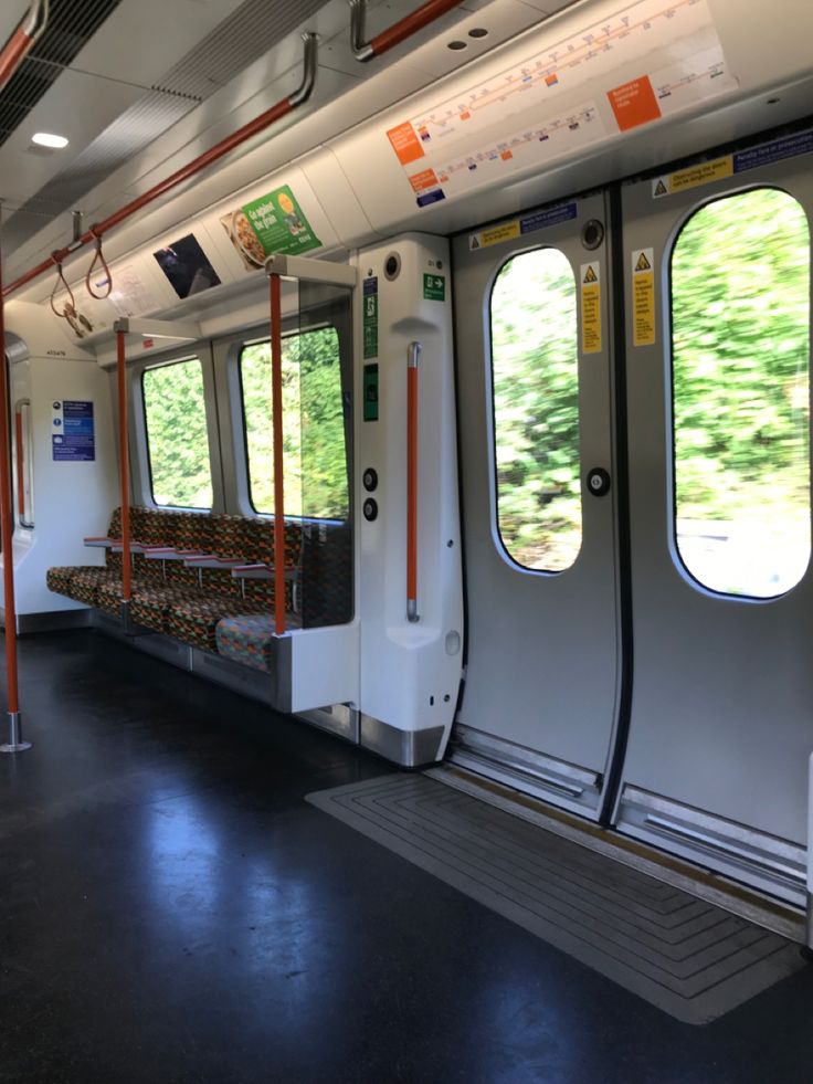 an empty train car with lots of windows