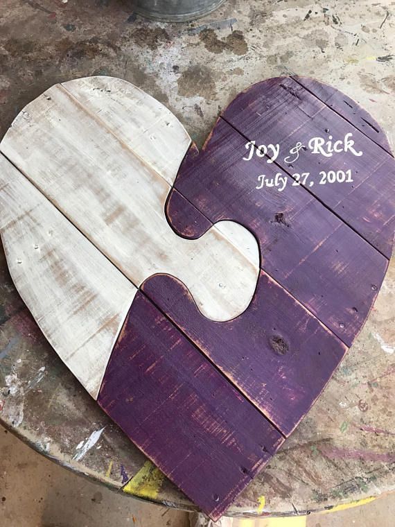 a wooden heart shaped puzzle sitting on top of a table