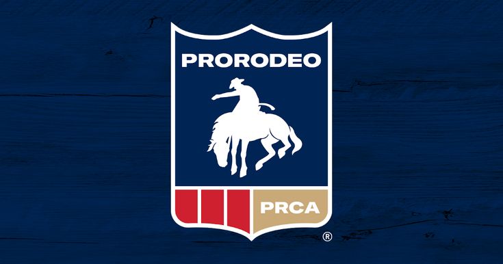 the pro rodeo logo on a wooden background