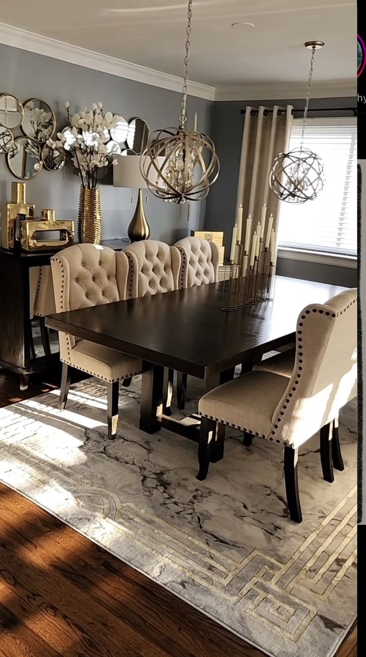 a dining room table with chairs and chandelier