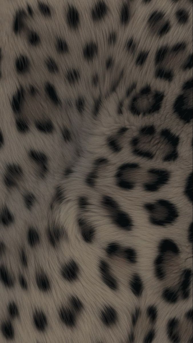 an animal with black spots on it's fur