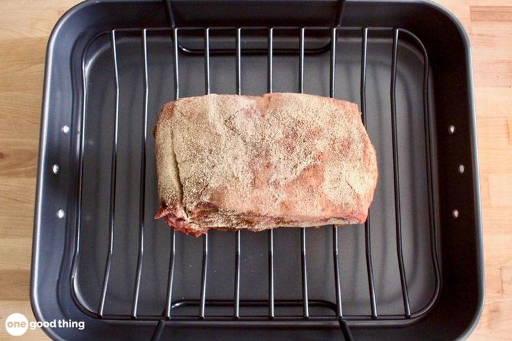 a piece of meat is cooking on a grill