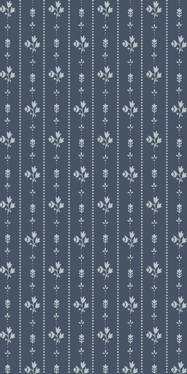 a blue and white striped wallpaper with small flowers on the bottom half of it