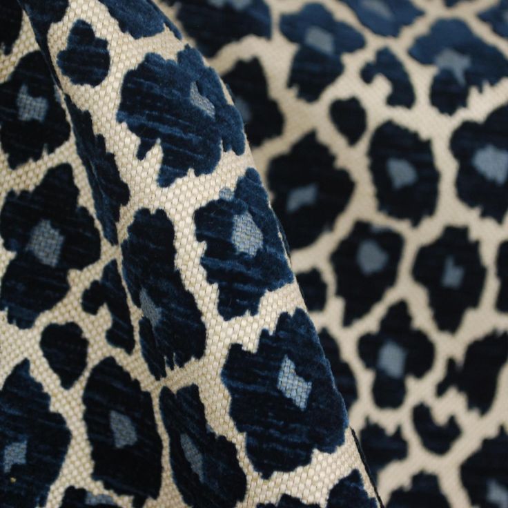 an animal print fabric with blue and white colors