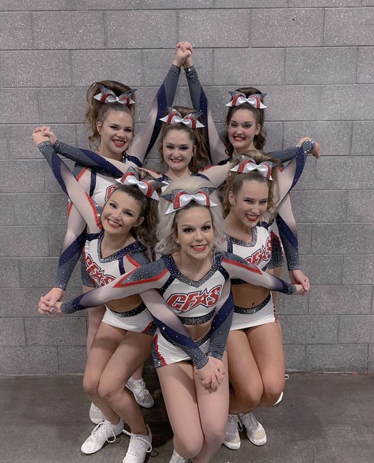 a group of cheerleaders posing for a photo