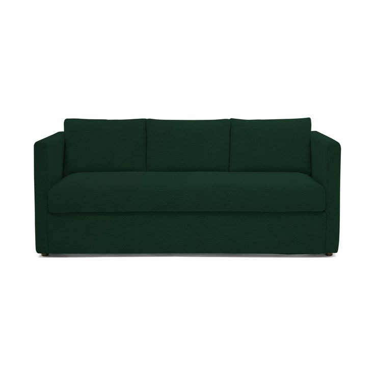 a green couch sitting on top of a white floor