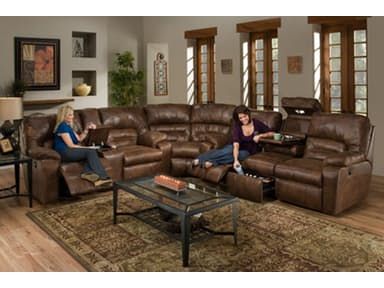 two women sitting on couches in a living room