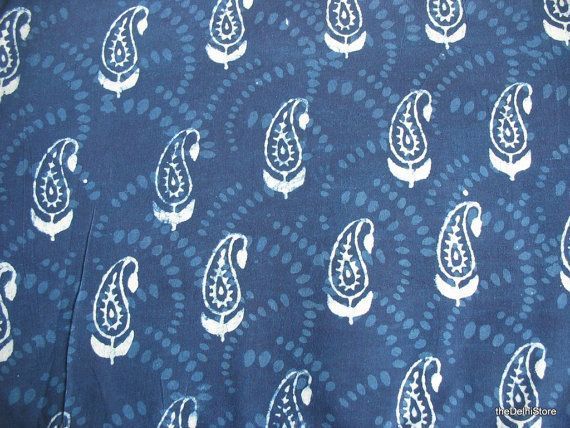 a blue tie with white paisley designs on it